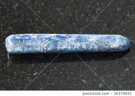 polished Kyanite crystal gemstone on dark polished Kyanite crystal gemstone on dark 36378641