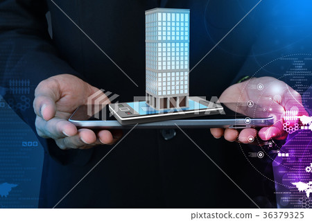 Smart hand showing smart phone with real estate Smart hand showing smart phone with real estate 36379325