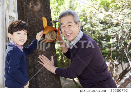 Grandfather, grandson, new house, making 36380792