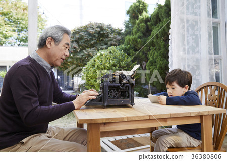 Grandfather, grandson, typewriter, cellphone 36380806