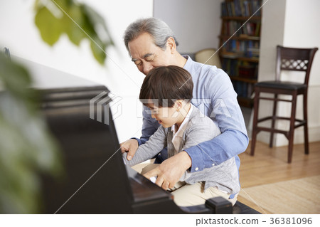 Grandfather, grandson, piano 36381096