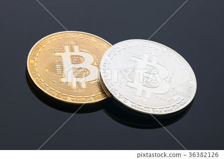 Golden and silver bitcoin cryptocurrency on black  36382126