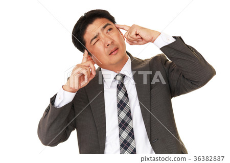 An agonizing businessman An agonizing businessman 36382887