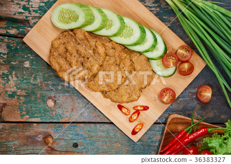 Vietnam fried fish patty with vegetable and sauce. 36383327