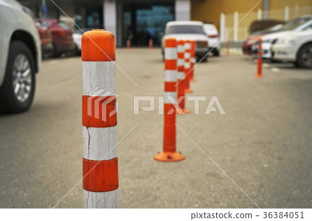 Plastic restricting bollards on the parking area Plastic restricting bollards on the parking area 36384051