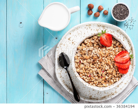 bowl with muesli, fresh strowberry, nuts, chia 36384194