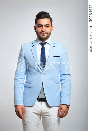 Stylish businessman at studio 36384632
