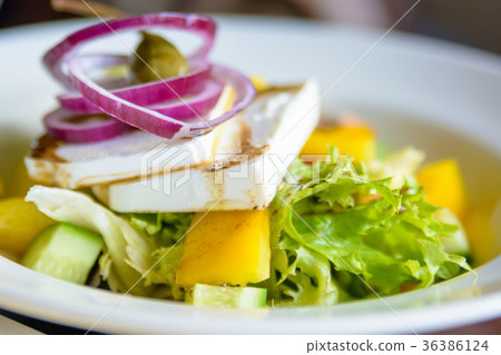 Close up plate with Greek salad in restaurant Close up plate with Greek salad in restaurant 36386124