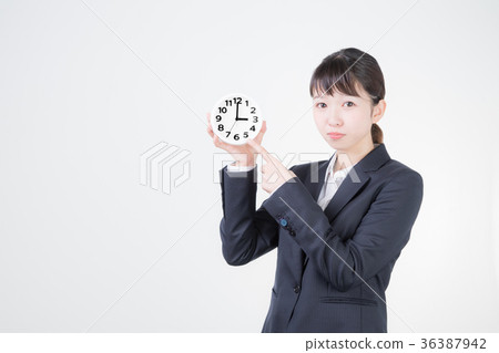 Business woman and watch (3 o'clock) Business woman and watch (3 o'clock) 36387942