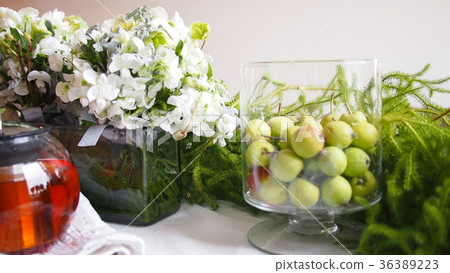 Flowers and greens of the party table Flowers and greens of the party table 36389223