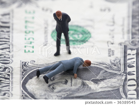 Financial crisis. Figure of businessman on one usd 36389545