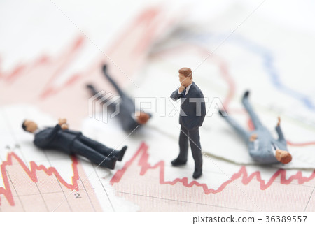 Figures of businessman on financial charts  36389557