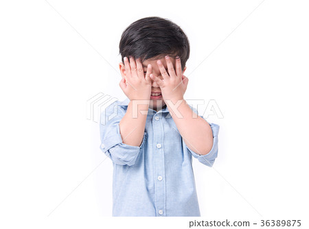 Kid covering his eyes over white background. Kid covering his eyes over white background. 36389875