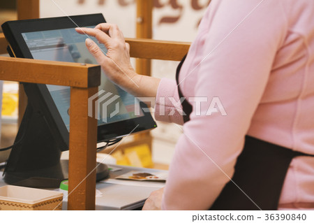 The cashier at the bakery The cashier at the bakery 36390840