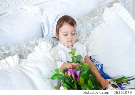 Cute little girl jumping on white bed Cute little girl jumping on white bed 36391079