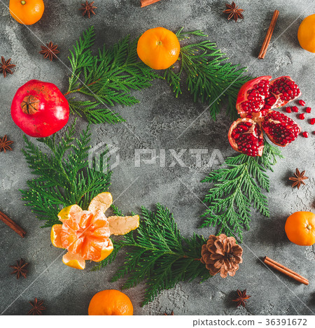 New year concept. Frame of garnet and citrus New year concept. Frame of garnet and citrus 36391672
