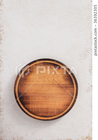 round cutting board at abstract background 36392305