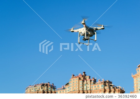 Drone quad copter over the city 36392460