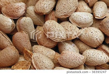 Whole raw almond nuts with shell close up Whole raw almond nuts with shell close up 36393247