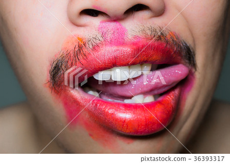 Mouth stained the color of lipstick. Mouth stained the color of lipstick. 36393317