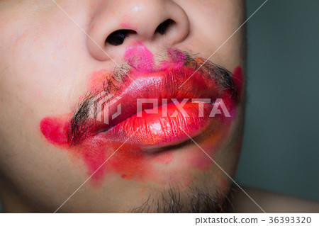 Mouth stained the color of lipstick. Mouth stained the color of lipstick. 36393320