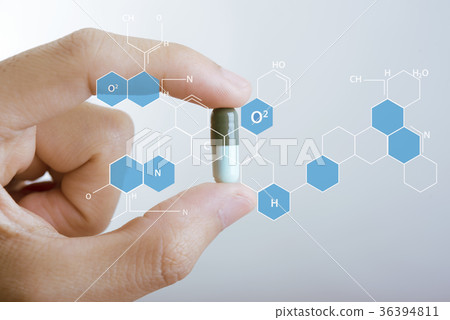 hand holding capsule medicine with icon chemical hand holding capsule medicine with icon chemical 36394811