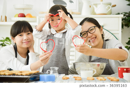 Happy Asian family holding red hearts shape. 36395163