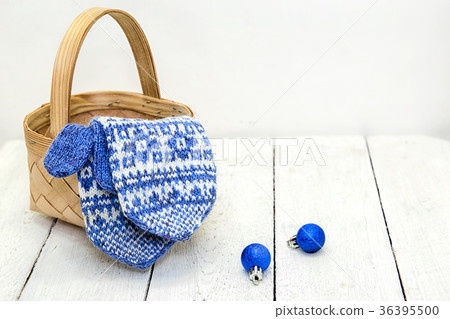 Warm mittens, basket and blue balls Warm mittens, basket and blue balls 36395500