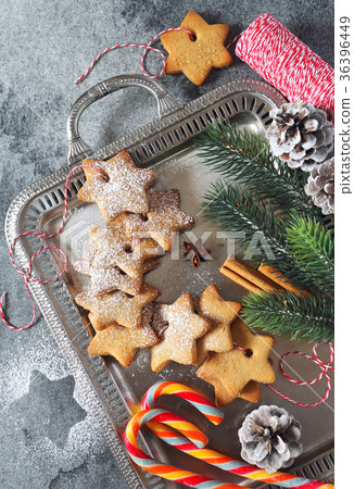 Cinnamon cookies, candies and New Year decorations Cinnamon cookies, candies and New Year decorations 36396449
