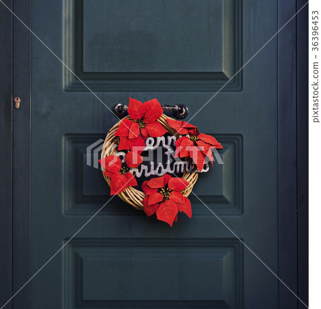 traditional red and green Christmas wreath on a 36396453