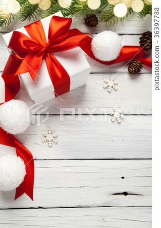 Christmas presents in red boxes at white wooden Christmas presents in red boxes at white wooden 36397788