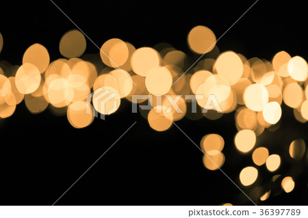Abstract gold sparkle on dark background Abstract gold sparkle on dark background 36397789