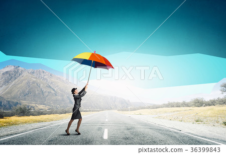 Woman flying on umbrella 36399843