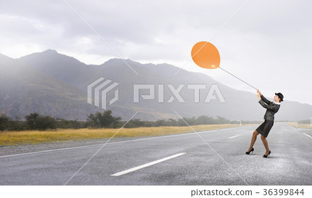 Woman fly on balloon 36399844