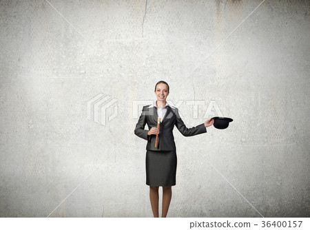 Woman magician with bowler hat 36400157