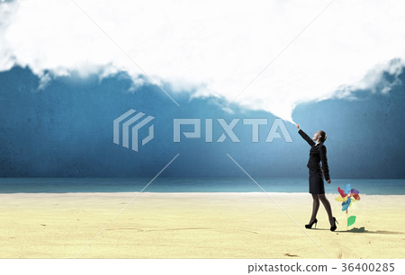 Smiling businesswoman carrying big cloud in hands 36400285