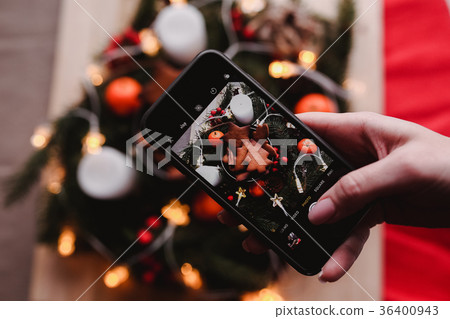 Woman's hand take a mobile photo of New Year's 36400943