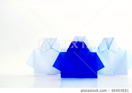 One blue among white origami shirt paper 36403681