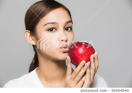 A woman with an apple A woman with an apple 36404640