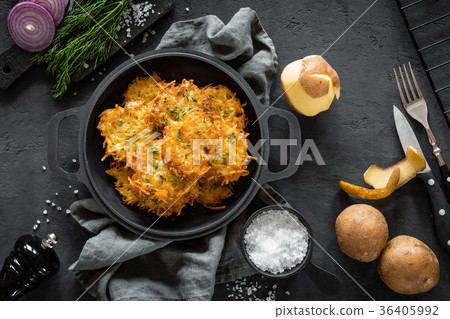 Potato pancakes on dark background, top view 36405992