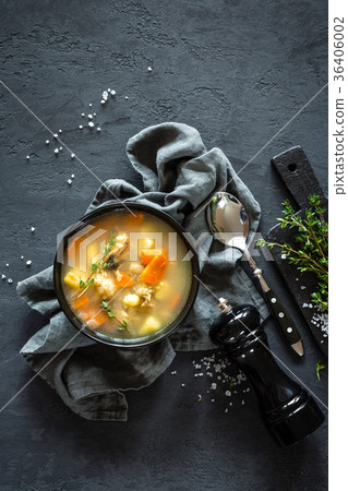 Fresh fish soup in bowl on dark background Fresh fish soup in bowl on dark background 36406002