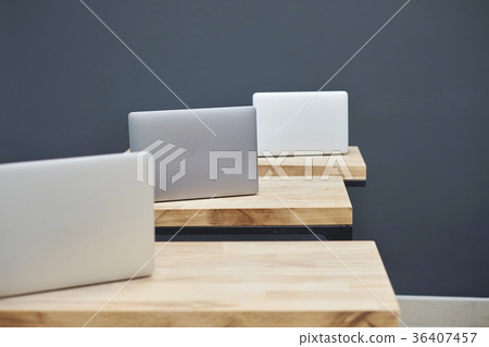 several laptops on the tables several laptops on the tables 36407457