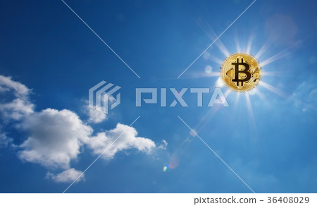 Golden bitcoin glowing in the blue sky instead of 36408029