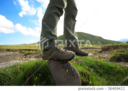 hiker legs stand on rock outdoors hiker legs stand on rock outdoors 36409411