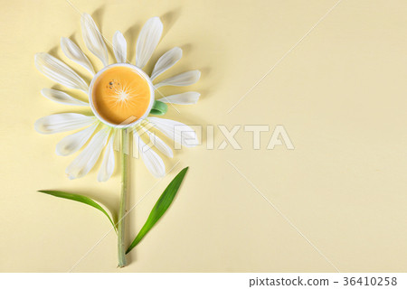 Cup of coffee and petals create flower 36410258