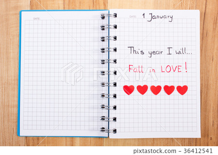 New years resolutions written in notebook 36412541