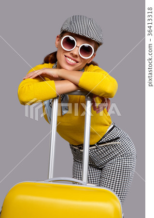 Glamour woman with yellow  suitcase, travel concept 36413318