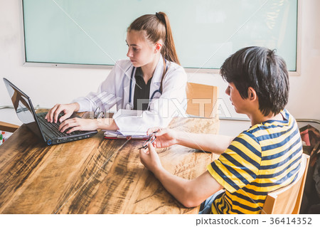 Female doctor explaining diagnosis to her patient. Female doctor explaining diagnosis to her patient. 36414352