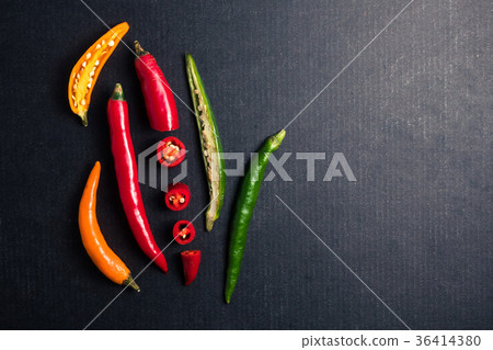 Colorful mix of chili pappers on black background. Colorful mix of chili pappers on black background. 36414380