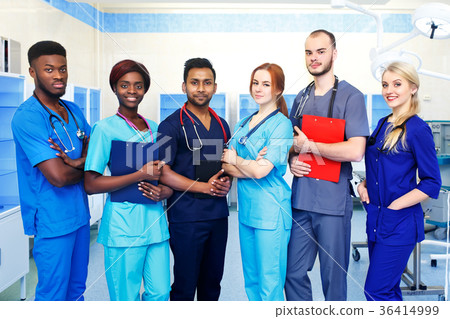 Multiracial team of young doctors in a hospital Multiracial team of young doctors in a hospital 36414999